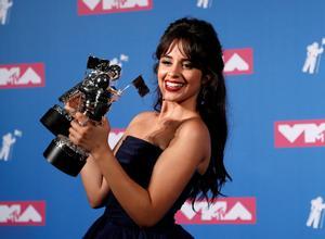 2018 MTV Video Music Awards - Photo Room - Radio City Music Hall, New York, U.S., August 20, 2018. - Camila Cabello poses backstage with her awards for Artist of the Year and Video of the Year for Havana. REUTERS/Carlo Allegri      TPX IMAGES OF THE DAY