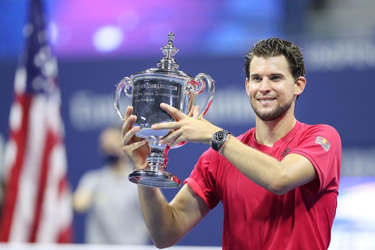 NEW YORK, NEW YORK - SEPTEMBER 13: Dominic Thiem of Austria celebrates with championship trophy after winning in a tie-breaker during his Men’s Singles final match against Alexander Zverev of Germany on Day Fourteen of the 2020 US Open at the USTA Billie Jean King National Tennis Center on September 13, 2020 in the Queens borough of New York City.   Matthew Stockman/Getty Images/AFP
