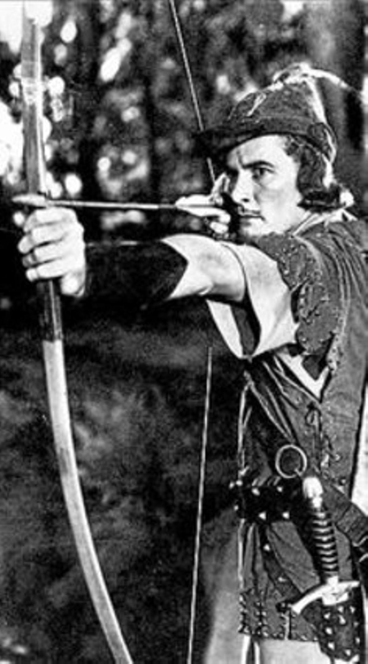 Errol Flynn, como Robin Hood.