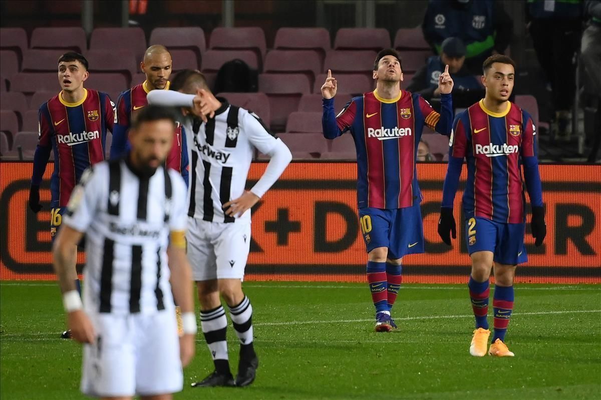 Barcelona s Argentinian forward Lionel Messi (2R) celebrates after scoring during the Spanish league football match between FC Barcelona and Levante UD at the Camp Nou stadium in Barcelona on December 13 2020 (Photo by LLUIS GENE AFP) Barcelona s Argentinian forward Lionel Messi (2R) celebrates after scoring during the Spanish league football match between FC Barcelona and Levante UD at the Camp Nou stadium in Barcelona on December 13 2020 (Photo by LLUIS GENE AFP)