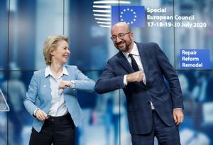 European Council President Charles Michel and European Commission President Ursula Von Der Leyen do an elbow bump at the end of a news conference following a four-day European summit at the European Council in Brussels, Belgium, July 21, 2020. Stephanie Lecocq/Pool via REUTERS