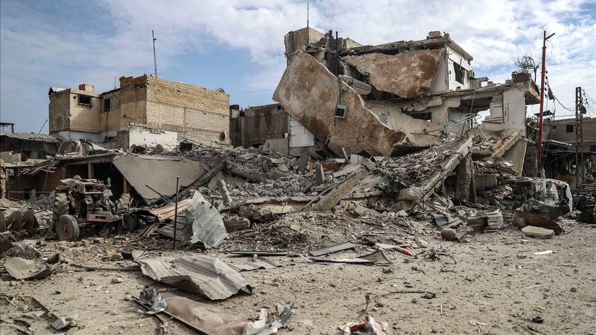 Edificios destruidos tras un bombardeo al este de Guta, en Duma (Siria), el 20 de febrero. Edificios destruidos tras un bombardeo al este de Guta, en Duma (Siria), el 20 de febrero.