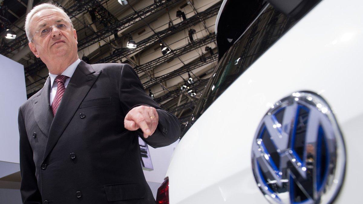 FILE  In this May 13, 2014 file picture then Volkswagen CEO , Martin Winterkorn, stands next to a VW car  at the annual shareholder meeting in Hannover, Germany.   German prosecutors said Monday June 20, 2016  they have opened an investigation of former Volkswagen CEO Martin Winterkorn on allegations of market manipulation in connection with the company’s scandal over cars rigged to cheat on U.S. diesel emissions tests.  ( Julian Stratenschulte/dpa via AP,file)