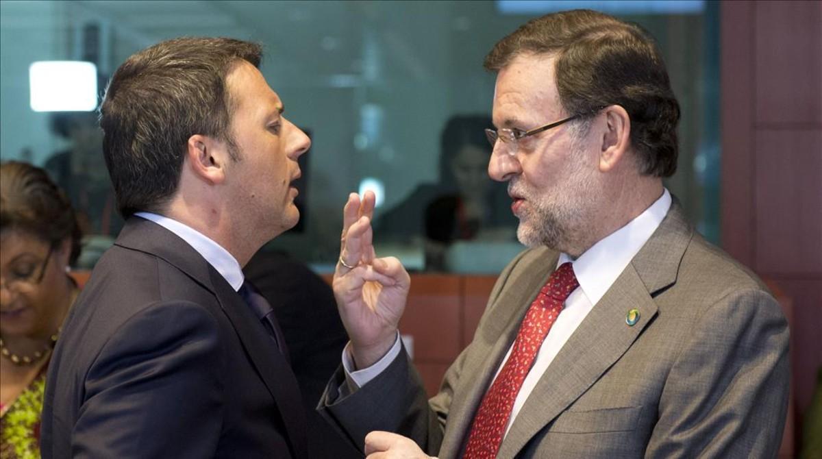 El primer ministro italiano, Matteo Renzi, y Mariano Rajoy, en una fotografía tomada en una cumbre europea en el 2014. 