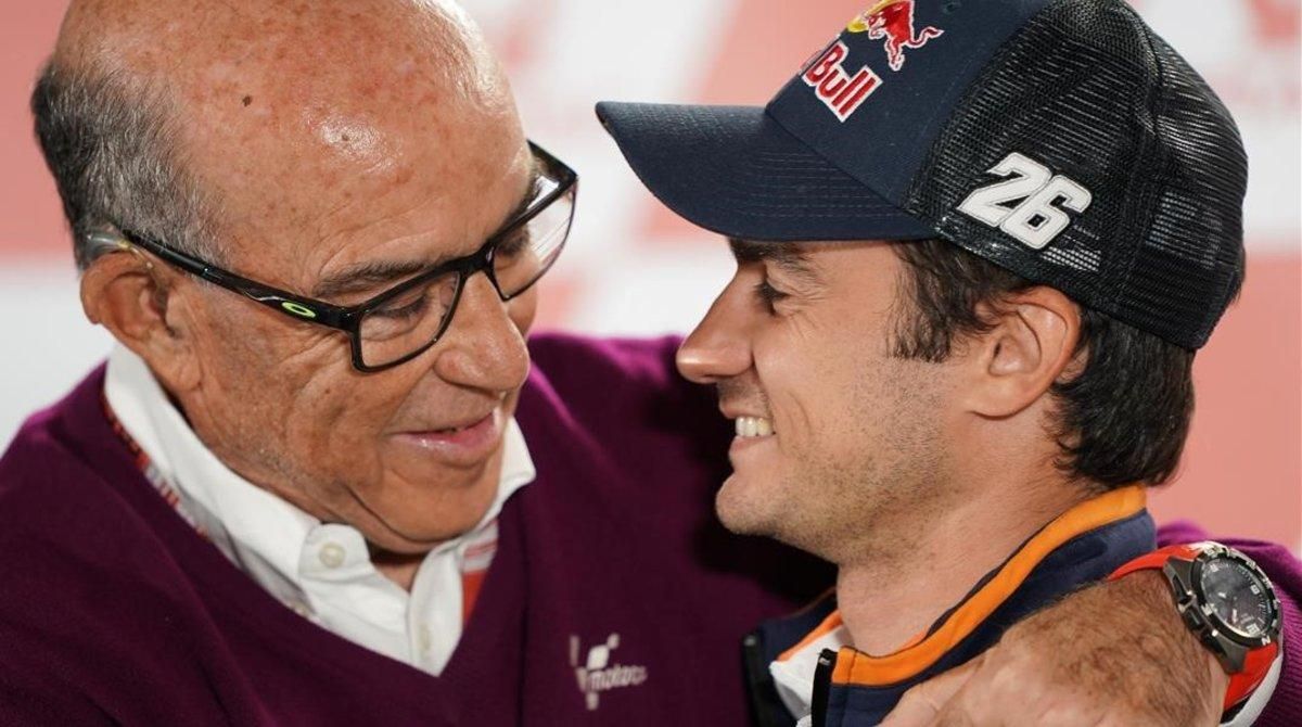 Carmelo Ezpeleta, máximo responsable del Mundial, junto a Dani Pedrosa. Carmelo Ezpeleta, máximo responsable del Mundial, junto a Dani Pedrosa.