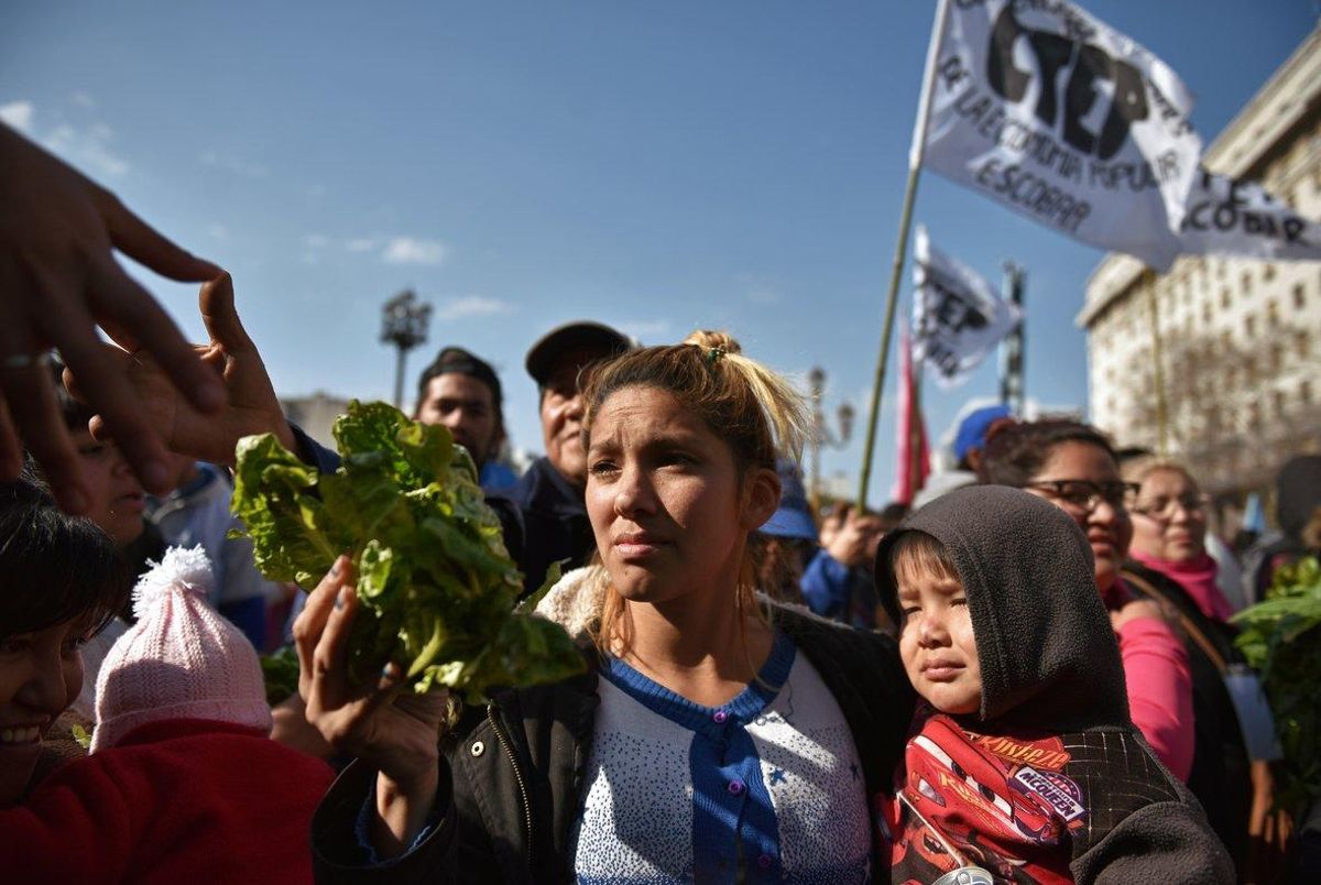 People receive free vegetables while protesting social conditions during the day of Saint Cajetan the patron saint of Argentina and labour in Buenos Aires Argentina August 7 2019 REUTERS Pablo Stefanec NO RESALES NO ARCHIVES People receive free vegetables while protesting social conditions during the day of Saint Cajetan the patron saint of Argentina and labour in Buenos Aires Argentina August 7 2019 REUTERS Pablo Stefanec NO RESALES NO ARCHIVES