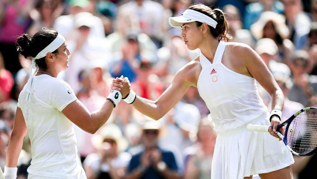 Jabeur y Muguruza tras el partido. Jabeur y Muguruza tras el partido.