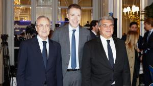 Joan Laporta y Florentino Pérez, con Bernd Reichart, en Madrid el pasado 16 de diciembre.