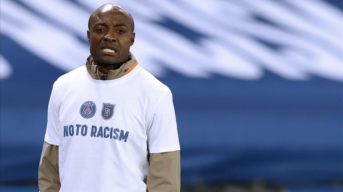 Paris (France) 09 12 2020 - Pierre Achille Webo assistant coach of Basaksehir wears a t-shirt featuring the two club logos and No To Racism prior to the UEFA Champions League group H soccer match between Paris Saint-Germain (PSG) and Istanbul Basaksehir at the Parc des Princes Stadium in Paris France 09 December 2020 The match is due to be replayed after being suspended on 08 December following alleged racist comments made by the fourth official (Liga de Campeones Francia Estanbul) EFE EPA IAN LANGSDON Paris (France) 09 12 2020 - Pierre Achille Webo assistant coach of Basaksehir wears a t-shirt featuring the two club logos and No To Racism prior to the UEFA Champions League group H soccer match between Paris Saint-Germain (PSG) and Istanbul Basaksehir at the Parc des Princes Stadium in Paris France 09 December 2020 The match is due to be replayed after being suspended on 08 December following alleged racist comments made by the fourth official (Liga de Campeones Francia Estanbul) EFE EPA IAN LANGSDON