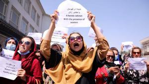 Afghan women’s rights defenders and civil activists protest to call on the Taliban for the preservation of their achievements and education, in front of the presidential palace in Kabul