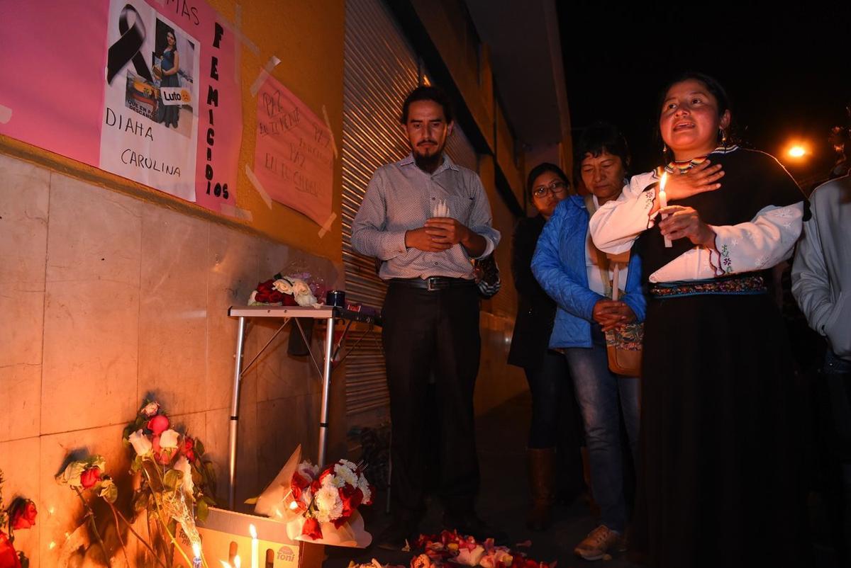 Local residents of the city of Ibarra in northern Ecuador pay homage at the site where an Ecuadorian woman was murdered by a Venezuelan man  in downtown Ibarra  - A femicide or gender-based murder committed in Ecuador by a Venezuelan man generated outbreaks of xenophobia against Venezuelan nationals that led the government to call for calm  but also to impose stiffer measures against migration   Photo by RODRIGO BUENDIA   AFP 