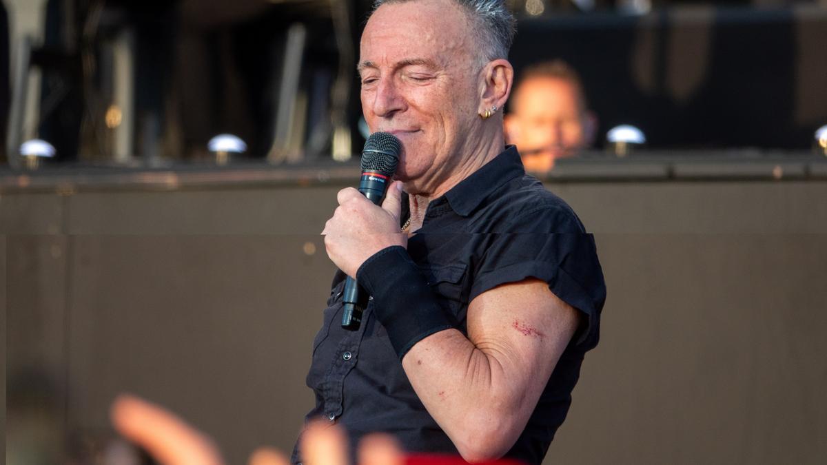 What is peptic ulcer that caused Bruce Springsteen to postpone his concerts?