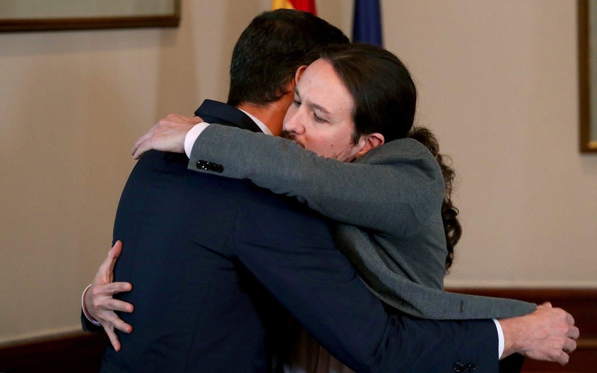 Spanish acting Prime Minister Pedro Sanchez and Unidas Podemos (Together We Can) leader Pablo Iglesias hug during a news conference at Spain’s Parliament in Madrid, Spain, November 12, 2019. REUTERS/Sergio Perez Spanish acting Prime Minister Pedro Sanchez and Unidas Podemos (Together We Can) leader Pablo Iglesias hug during a news conference at Spain’s Parliament in Madrid, Spain, November 12, 2019. REUTERS/Sergio Perez
