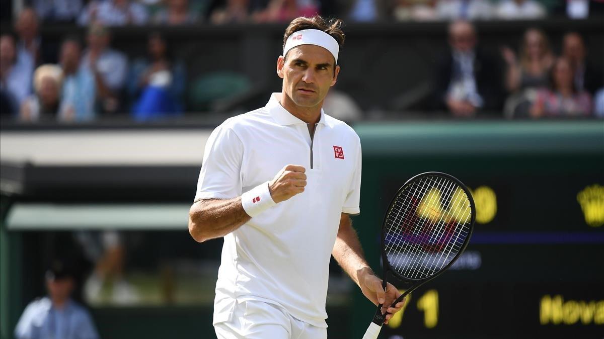 Federer celebra un punto Djokovic en la final de Wimbledon. Federer celebra un punto Djokovic en la final de Wimbledon.