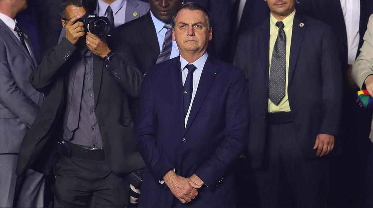 El presidente brasileño, Jair Bolsonaro, durante un encuentro de la Copa América entre Brasil y Bolivia, este viernes, en Sao Paulo. El presidente brasileño, Jair Bolsonaro, durante un encuentro de la Copa América entre Brasil y Bolivia, este viernes, en Sao Paulo.