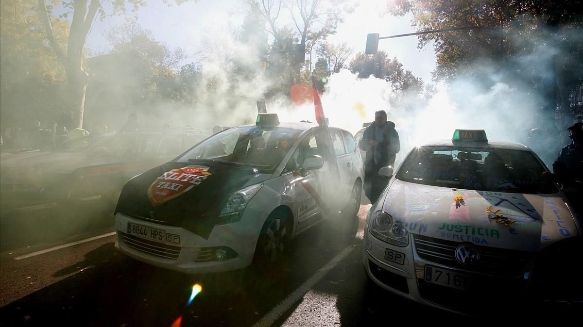 Un momento de la manifestación de taxistas celebrada en Madrid a finales de noviembre. Un momento de la manifestación de taxistas celebrada en Madrid a finales de noviembre.