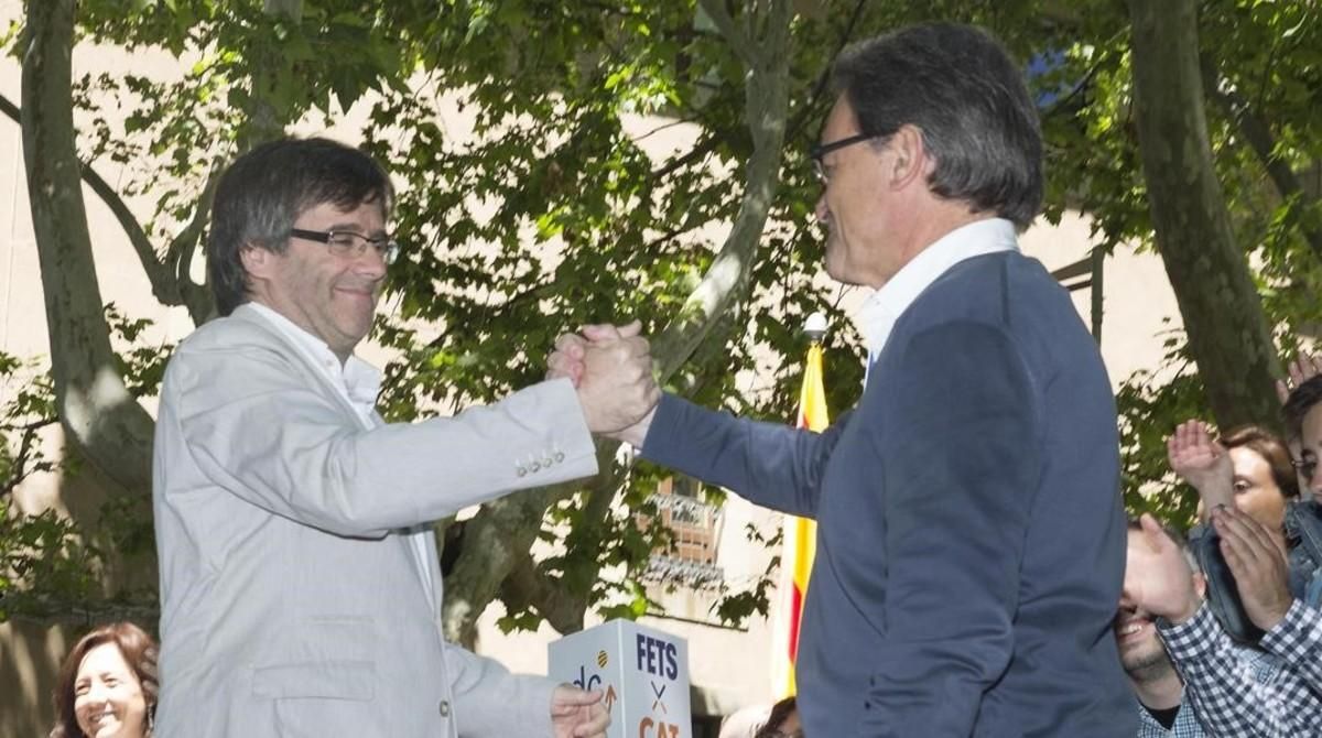 Artur Mas y Carles Puigdemont, en un acto de campaña reciente. Artur Mas y Carles Puigdemont, en un acto de campaña reciente.