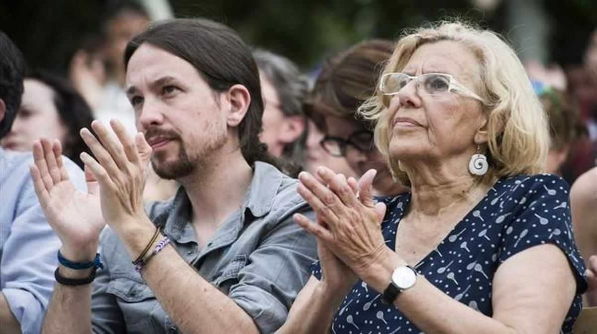 Pablo Iglesias y Manuela Carmena, en un mitin en Madrid. Pablo Iglesias y Manuela Carmena, en un mitin en Madrid.