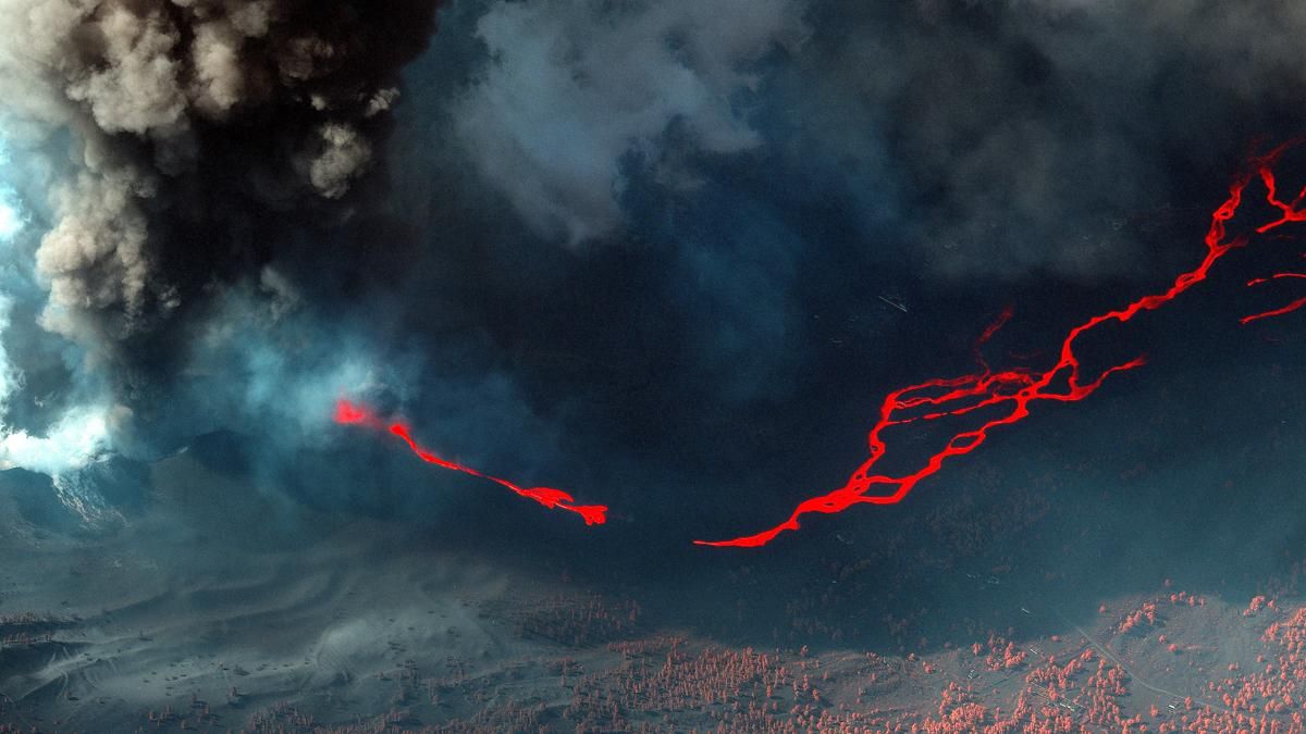 Una imagen de satélite en color infrarrojo muestra lava fluyendo mientras el volcán Cumbre Vieja continúa en erupción en la isla canaria de La Palma, España, 14 de octubre de 2021. Una imagen de satélite en color infrarrojo muestra lava fluyendo mientras el volcán Cumbre Vieja continúa en erupción en la isla canaria de La Palma, España, 14 de octubre de 2021.