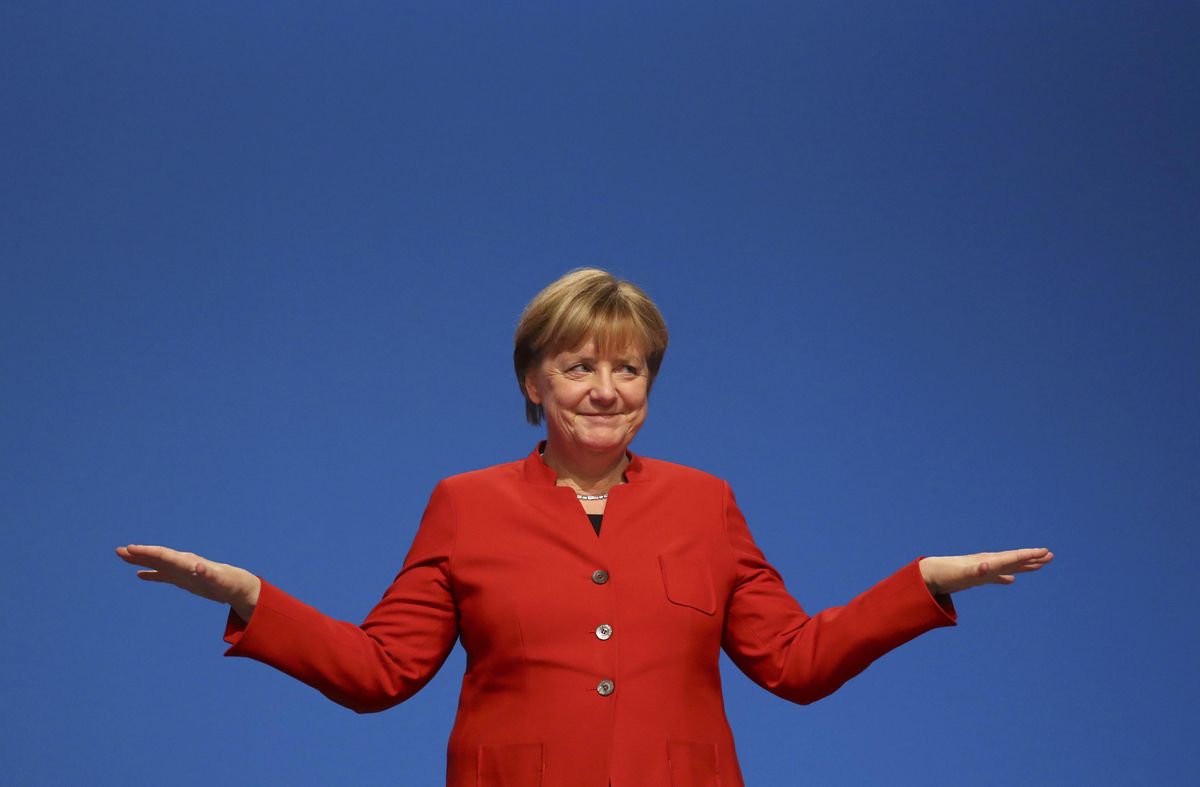 German Chancellor and leader of the conservative CDU Merkel reacts after her speech at the CDU party convention in Essen German Chancellor and leader of the conservative CDU Merkel reacts after her speech at the CDU party convention in Essen