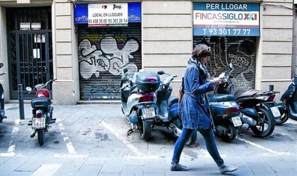 Locales comerciales cerrados en la calle de Sant Pere més Alt, en Ciutat Vella. Locales comerciales cerrados en la calle de Sant Pere més Alt, en Ciutat Vella.