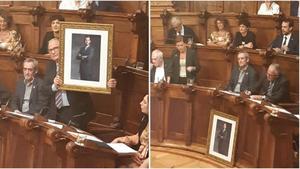 Bou esgrime el retrato del Rey, que luego ha dejado delante de su asiento, durante el pleno municipal de este lunes.