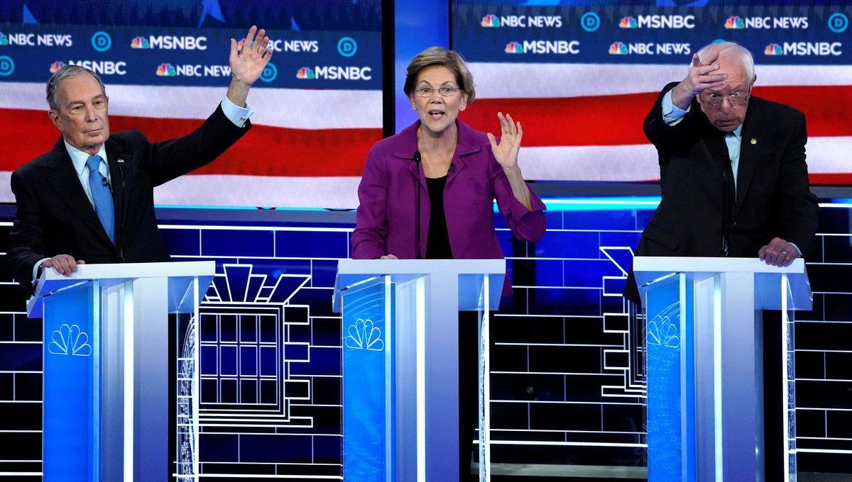Senator Elizabeth Warren speaks as former New York City Mayor Mike Bloomberg and Senator Bernie Sanders try to get the moderators’ attention at the ninth Democratic 2020 U.S. Presidential candidates debate at the Paris Theater in Las Vegas Nevada, U.S., February 19, 2020.     TPX IMAGES OF THE DAY