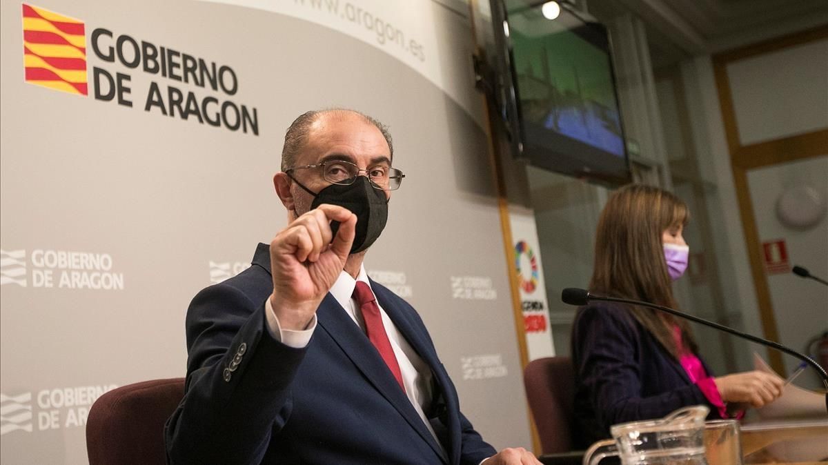 El presidente de Aragón, Javier Lamban junto con la Consejera de Sanidad, Sira Ripolles, comparecen en rueda de prensa para realizar un balance del impacto de un año de la pandemia. El presidente de Aragón, Javier Lamban junto con la Consejera de Sanidad, Sira Ripolles, comparecen en rueda de prensa para realizar un balance del impacto de un año de la pandemia.
