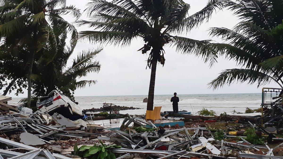 A man stands among ruins after a tsunami hit at Carita beach in Pandeglang, Banten province, Indonesia, December 23, 2018. REUTERS/Adi Kurniawan