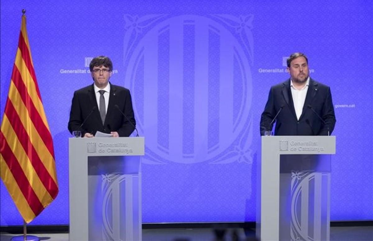 Carles Puigdemont y Oriol Junqueras.