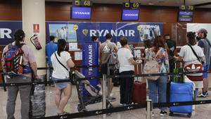 Several passengers stand in a queue in front of a Ryanair check-in desk at Terminal 2 of Barcelona-El Prat airport, Spain, 15 August 2022. Ryanair’s cabin crew begins a four-day strike in Spain on 15 August causing six flights were canceled and 78 other were delayed so far.EFE/ Quique Garcia