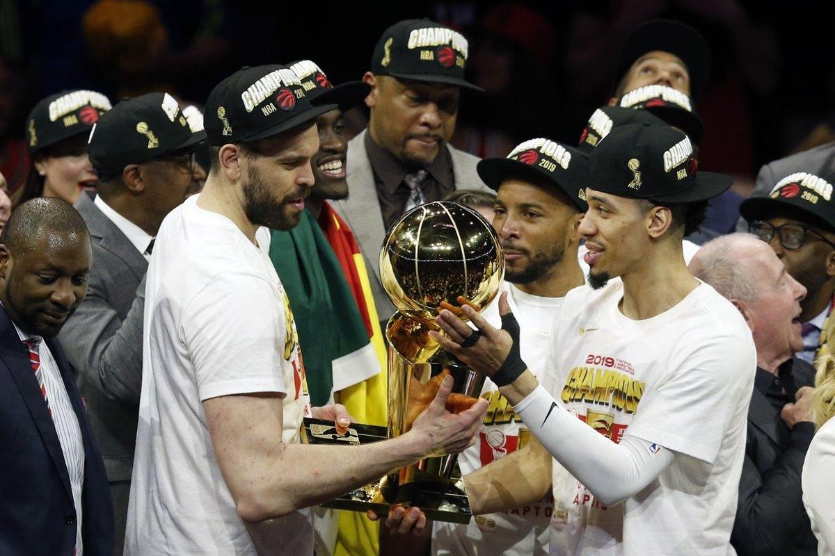 OAKLAND, CALIFORNIA - JUNE 13: Marc Gasol #33 and Danny Green #14 of the Toronto Raptors celebrate with the Larry O’Brien Championship Trophy after his team defeated the Golden State Warriors to win Game Six of the 2019 NBA Finals at ORACLE Arena on June 13, 2019 in Oakland, California. NOTE TO USER: User expressly acknowledges and agrees that, by downloading and or using this photograph, User is consenting to the terms and conditions of the Getty Images License Agreement. Lachlan Cunningham/Getty Images/AFP OAKLAND, CALIFORNIA - JUNE 13: Marc Gasol #33 and Danny Green #14 of the Toronto Raptors celebrate with the Larry O’Brien Championship Trophy after his team defeated the Golden State Warriors to win Game Six of the 2019 NBA Finals at ORACLE Arena on June 13, 2019 in Oakland, California. NOTE TO USER: User expressly acknowledges and agrees that, by downloading and or using this photograph, User is consenting to the terms and conditions of the Getty Images License Agreement. Lachlan Cunningham/Getty Images/AFP