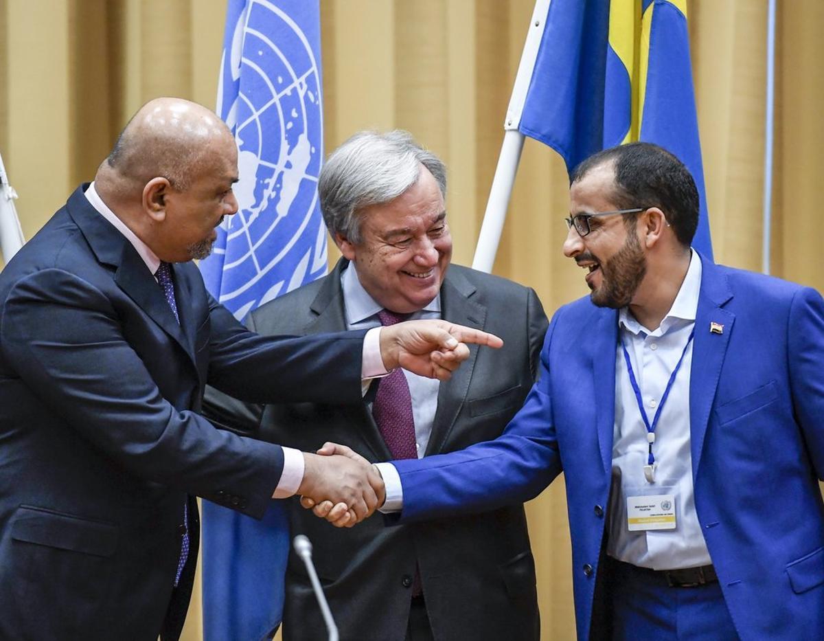 Head of delegation for rebel forces known as Houthis  Mohammed Abdulsalam  right  and Yemen Foreign Minister Khaled al-Yaman  left  shake hands together with UN Secretary Geleral Antonio Guterres  during the Yemen peace talks closing press conference at the Johannesberg castle in Rimbo north of Stockholm  Sweden.  Pontus Lundahl TT News agency via AP 