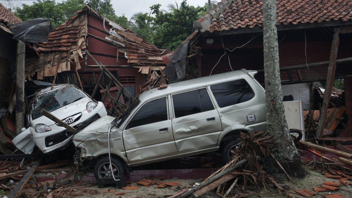 Damaged cars are seen among collapsed houses after a tsunami hit Banten, Indonesia, December 23, 2018 in this photo taken by Antara Foto.  Antara Foto/Dian Triyuli Handoko/ via REUTERS  ATTENTION EDITORS - THIS IMAGE WAS PROVIDED BY A THIRD PARTY. MANDATORY CREDIT. INDONESIA OUT.